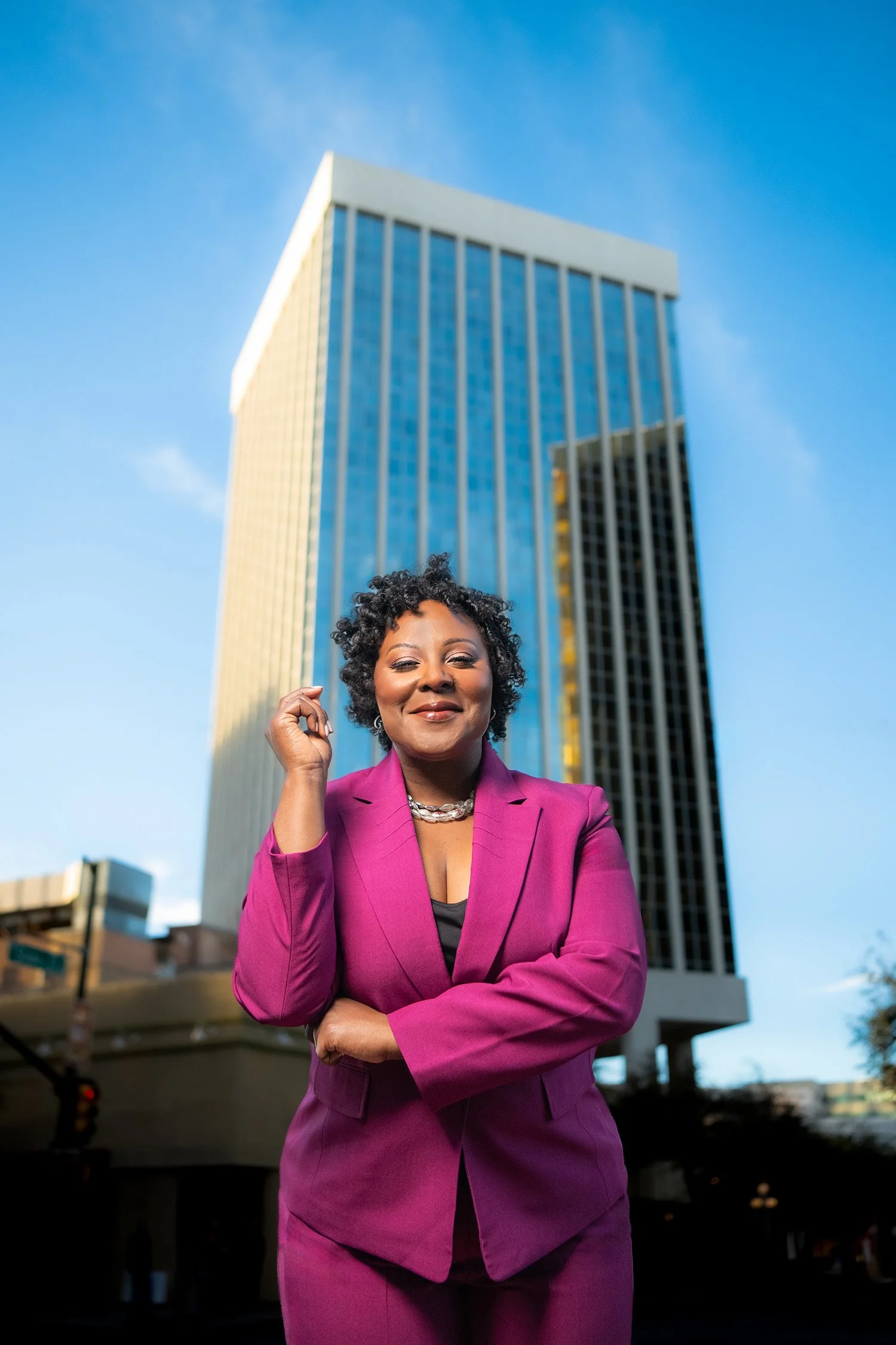 business woman standing in front of tucson building during a branding photo shoot