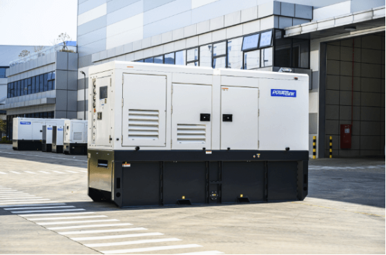 Large industrial generator unit outside a modern building.