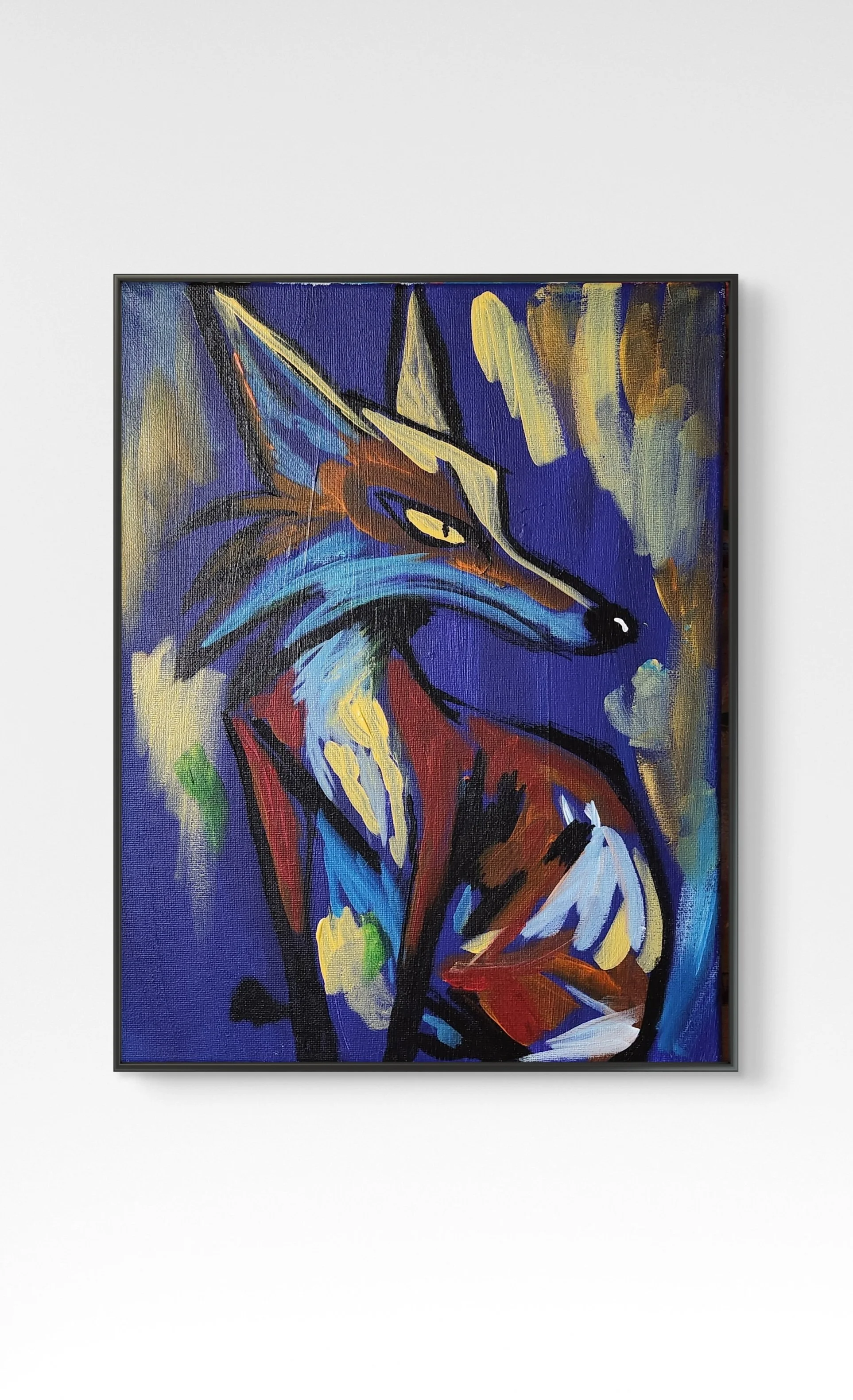 Colorful abstract painting of a fox on a dark blue background, with bold brushstrokes and vivid hues, framed on a white wall.