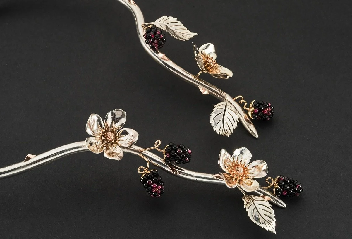 The Bramble Collection - Jewels of the Hedgerow 

Inspired by the wild beauty of farm hedgerows, The Bramble Collection is crafted in 9ct yellow and rose gold with sterling silver, featuring garnet, onyx, and peridot. The collection tells the story o