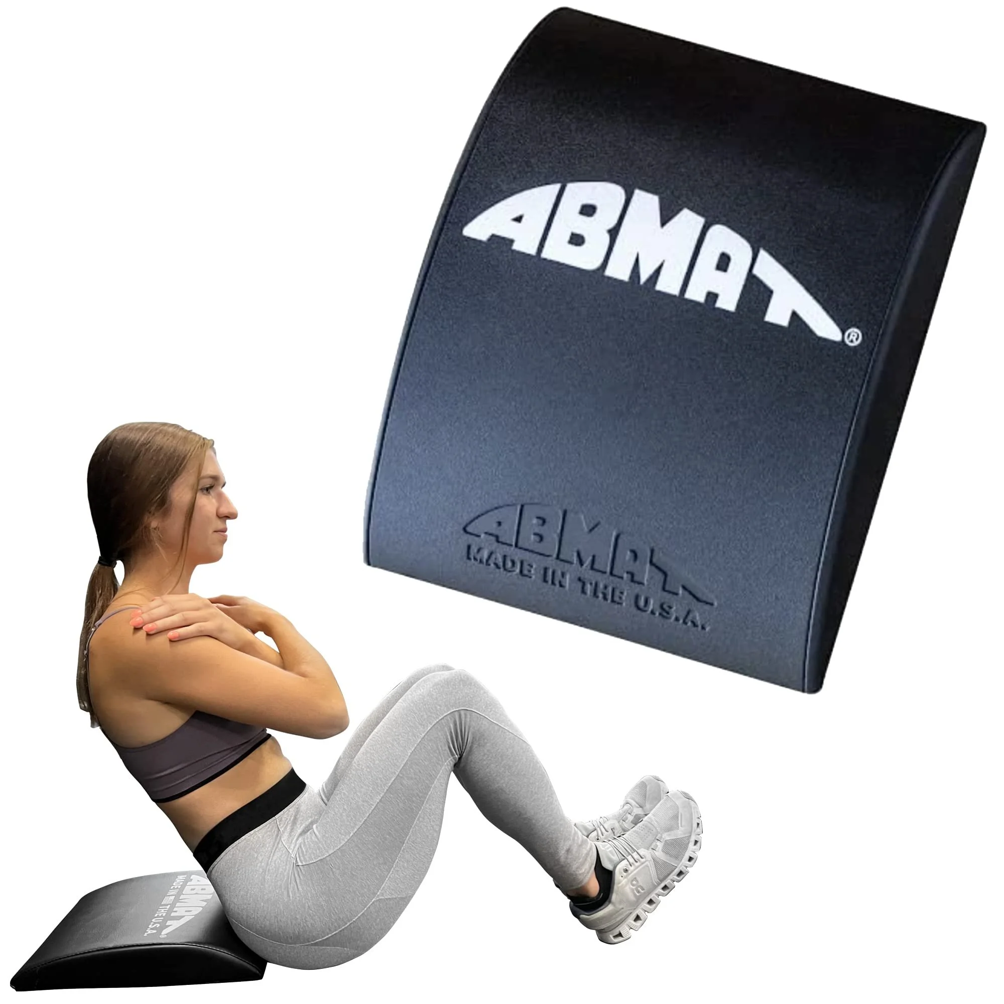 A woman in workout clothes sitting on an exercise ball with her arms crossed, next to a large black speaker with the ABMAR logo.