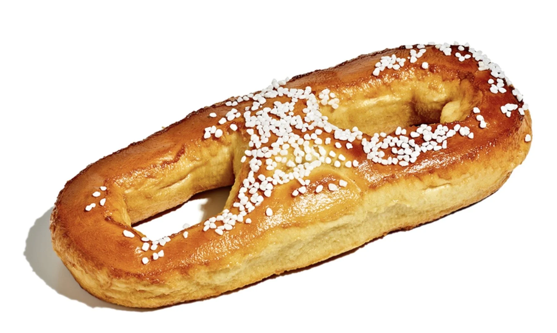A single piece of baked Danish pastry with a golden-brown crust, topped with white sugar crystals, on a white background.
