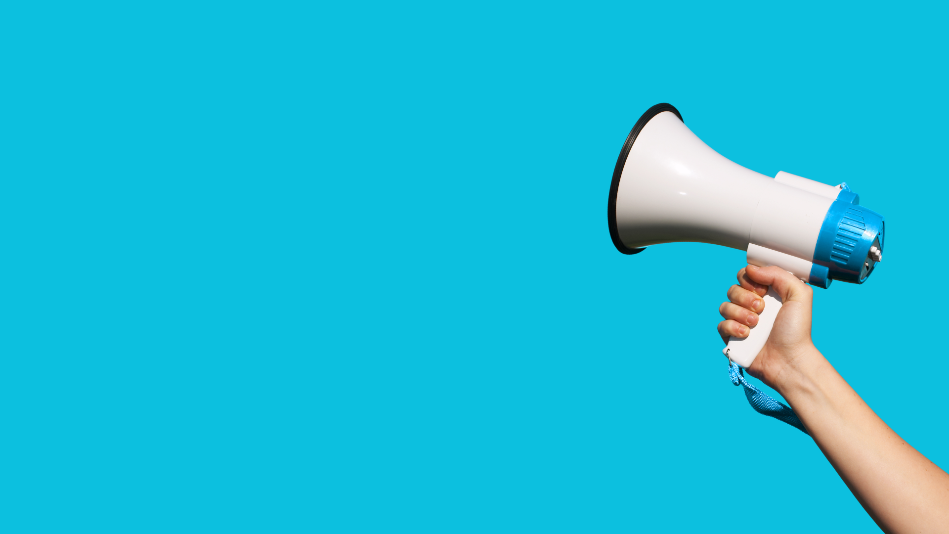 Arm holding up megaphone