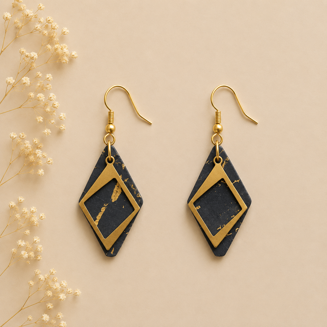 Black cork fabric earrings with gold flecks and layered gold diamond-shaped frames