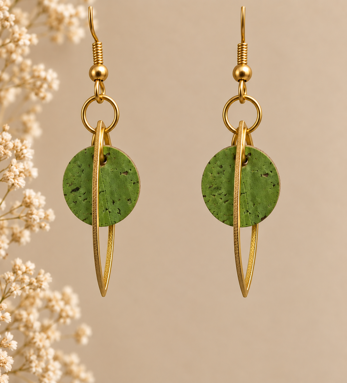 Round green cork fabric earrings with gold color marquise-shaped frames.