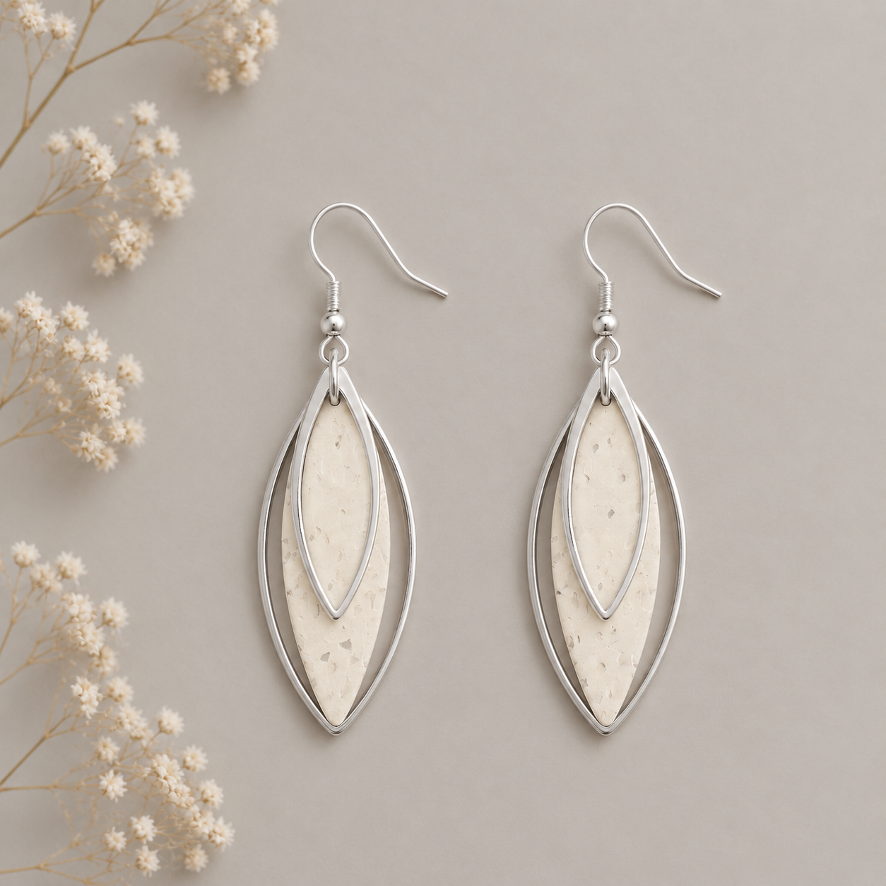 Leaf-shaped white cork fabric earrings with silver color layered frames