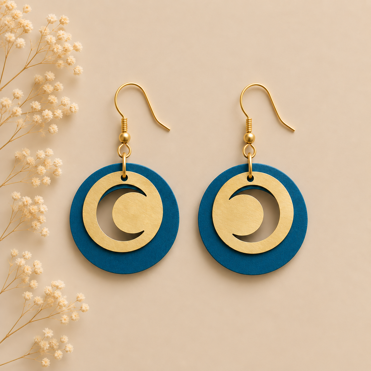 Round teal cork fabric earrings with gold color crescent moon details.