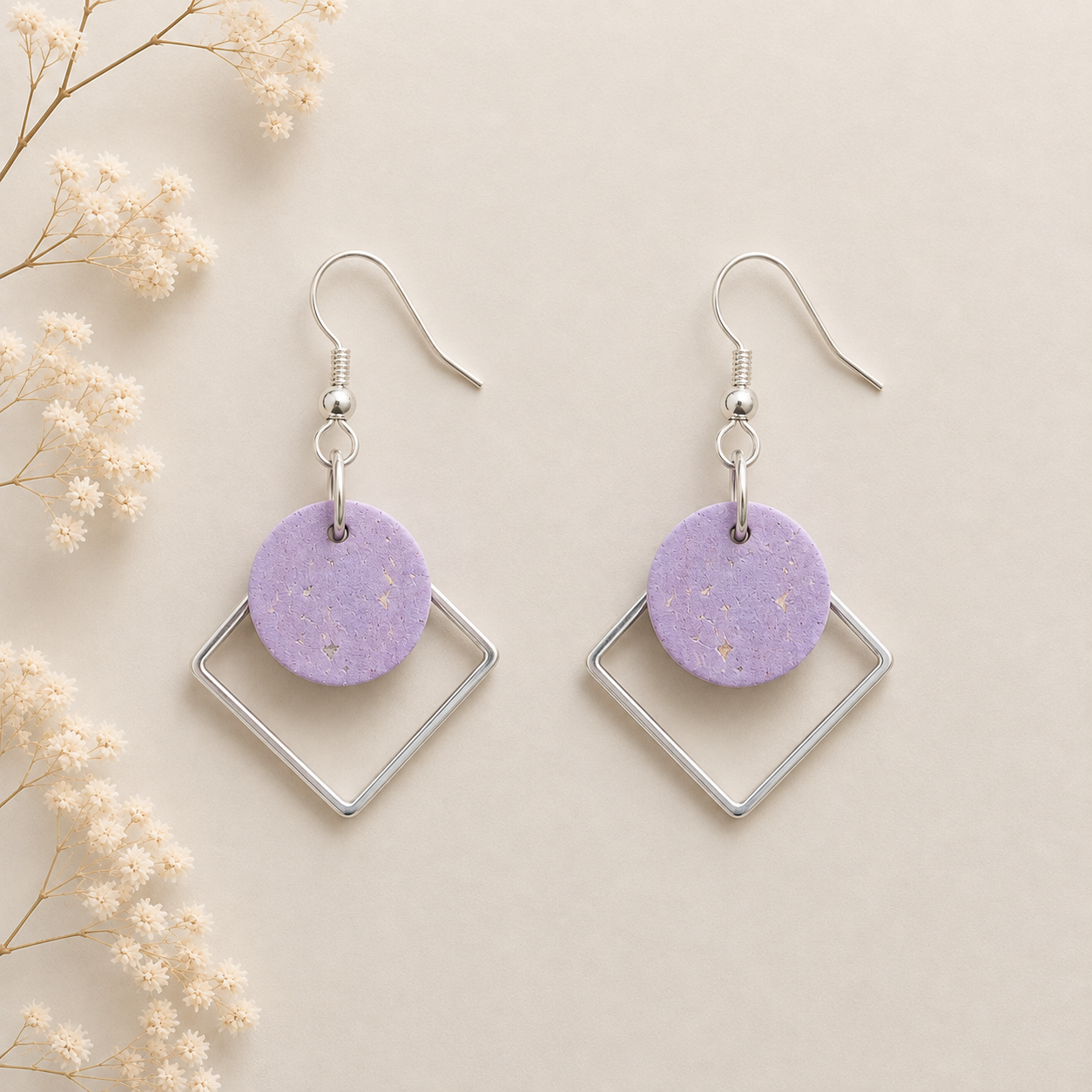 Round rose gold color cork fabric earrings with silver color diamond-shaped frames