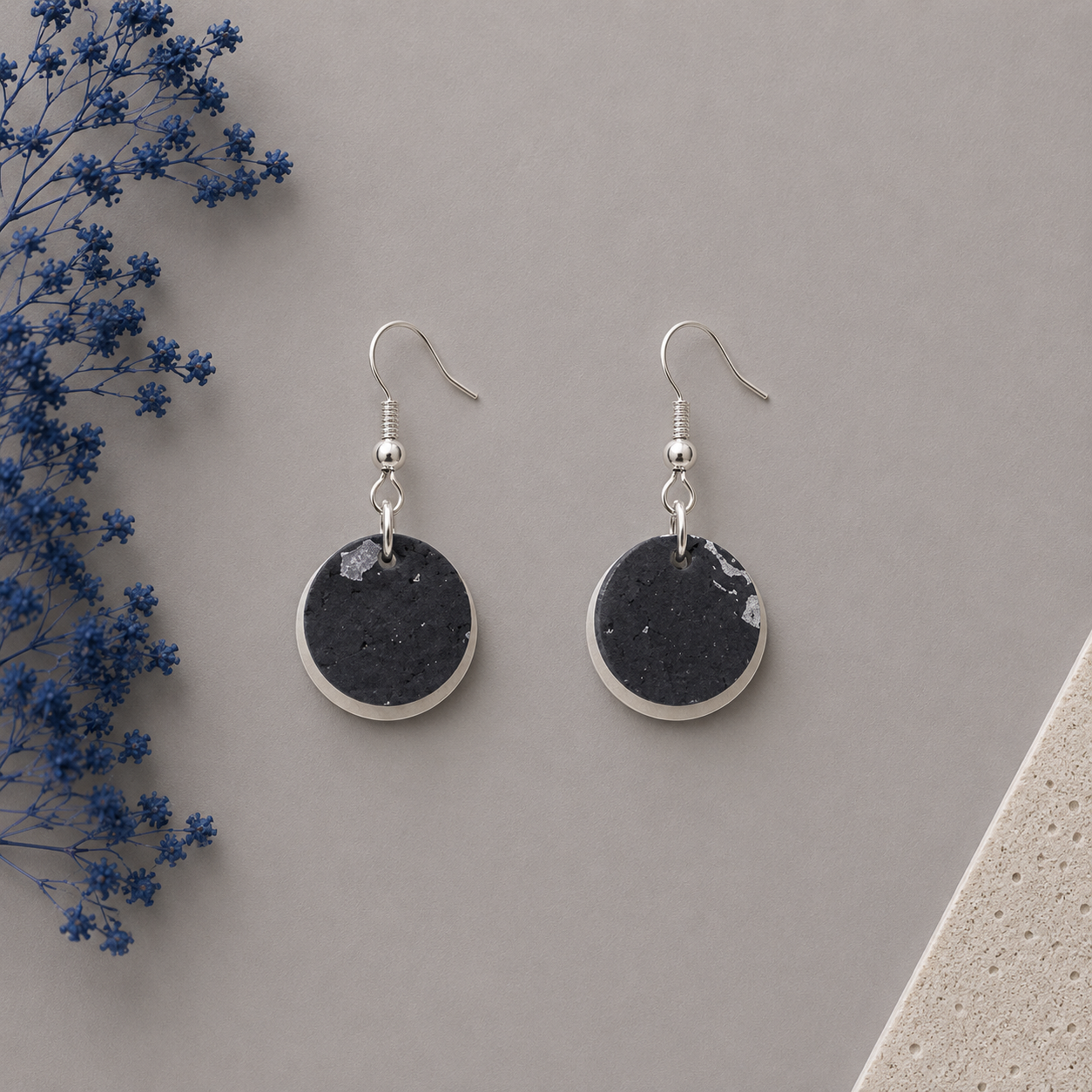 Round black with silver cork fabric earring with silver tone hardware