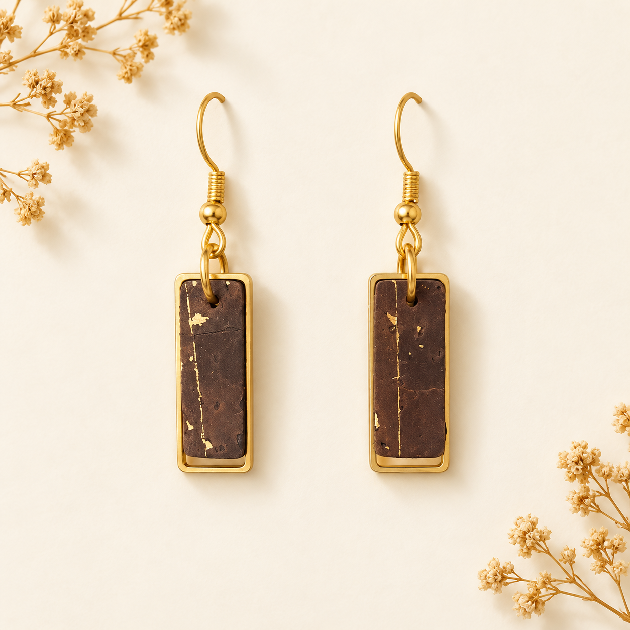 Column earrings with brown rectangular cork fabric, natural gold flecks, gold colored frames and hooks.