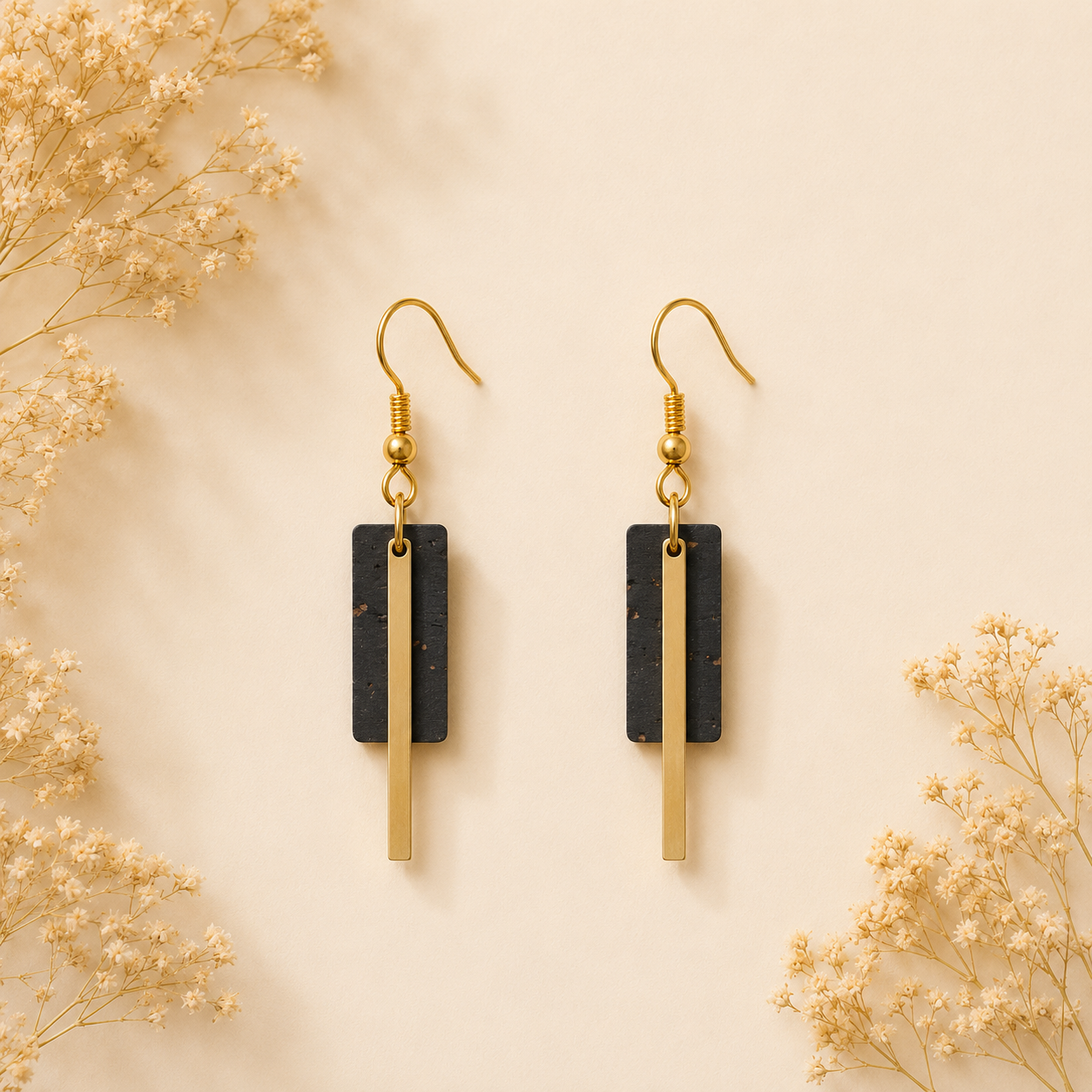 Geometric black cork fabric earrings with sleek gold color bar