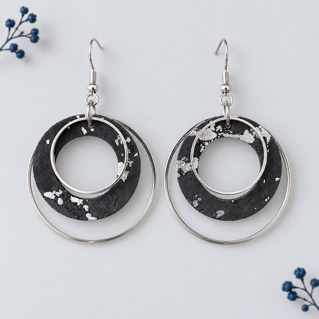 Black and silver colored cork fabric with layered silver color hoops
