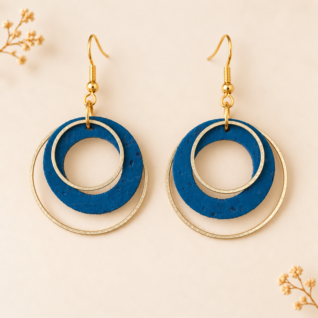teal colored cork fabric with layered gold color hoops
