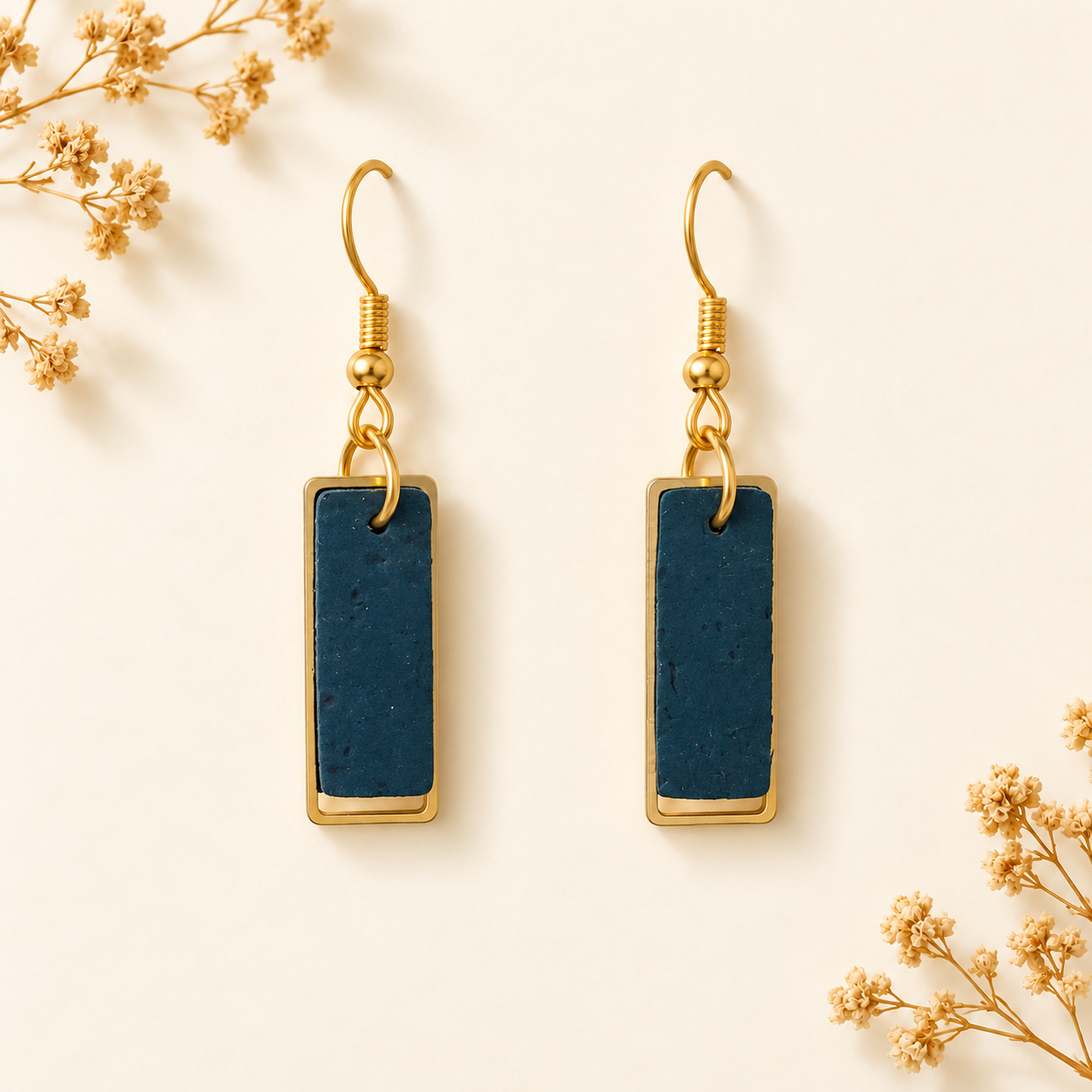 Column earrings with teal color cork fabric, natural gold flecks, gold colored frames and hooks.
