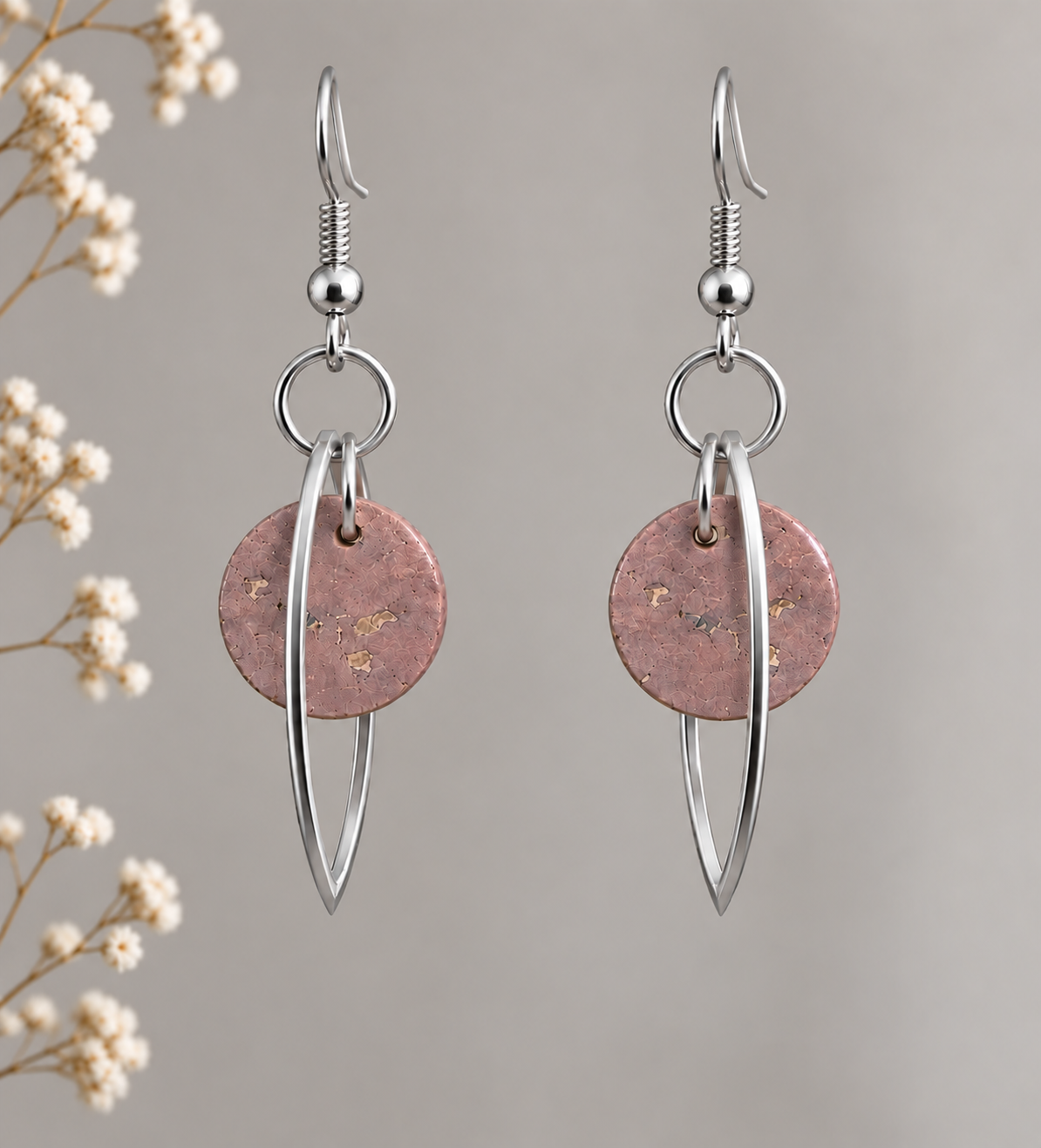 Round rose gold cork fabric earrings with silver color marquise-shaped frames.