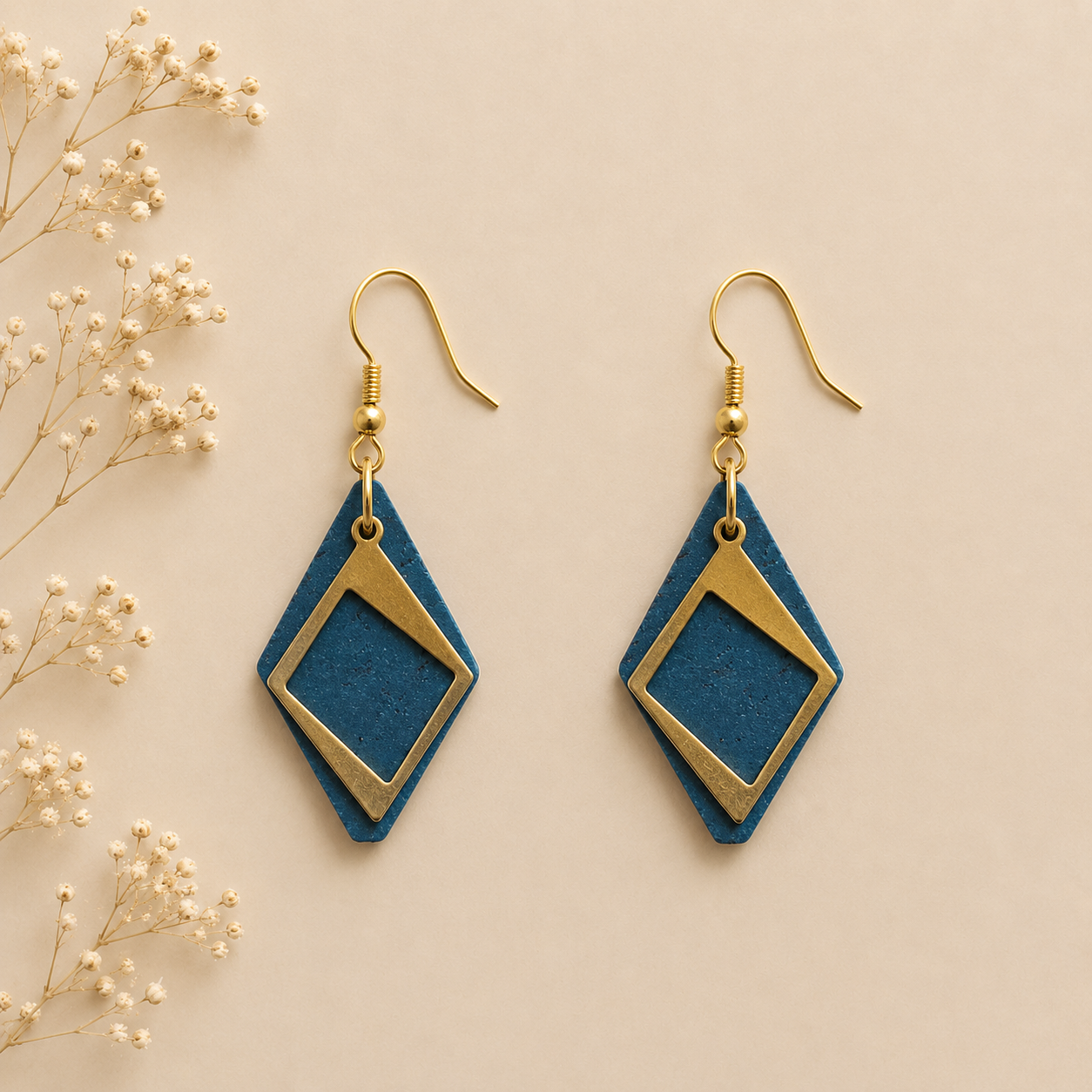 Teal cork fabric earrings with layered gold diamond-shaped frames