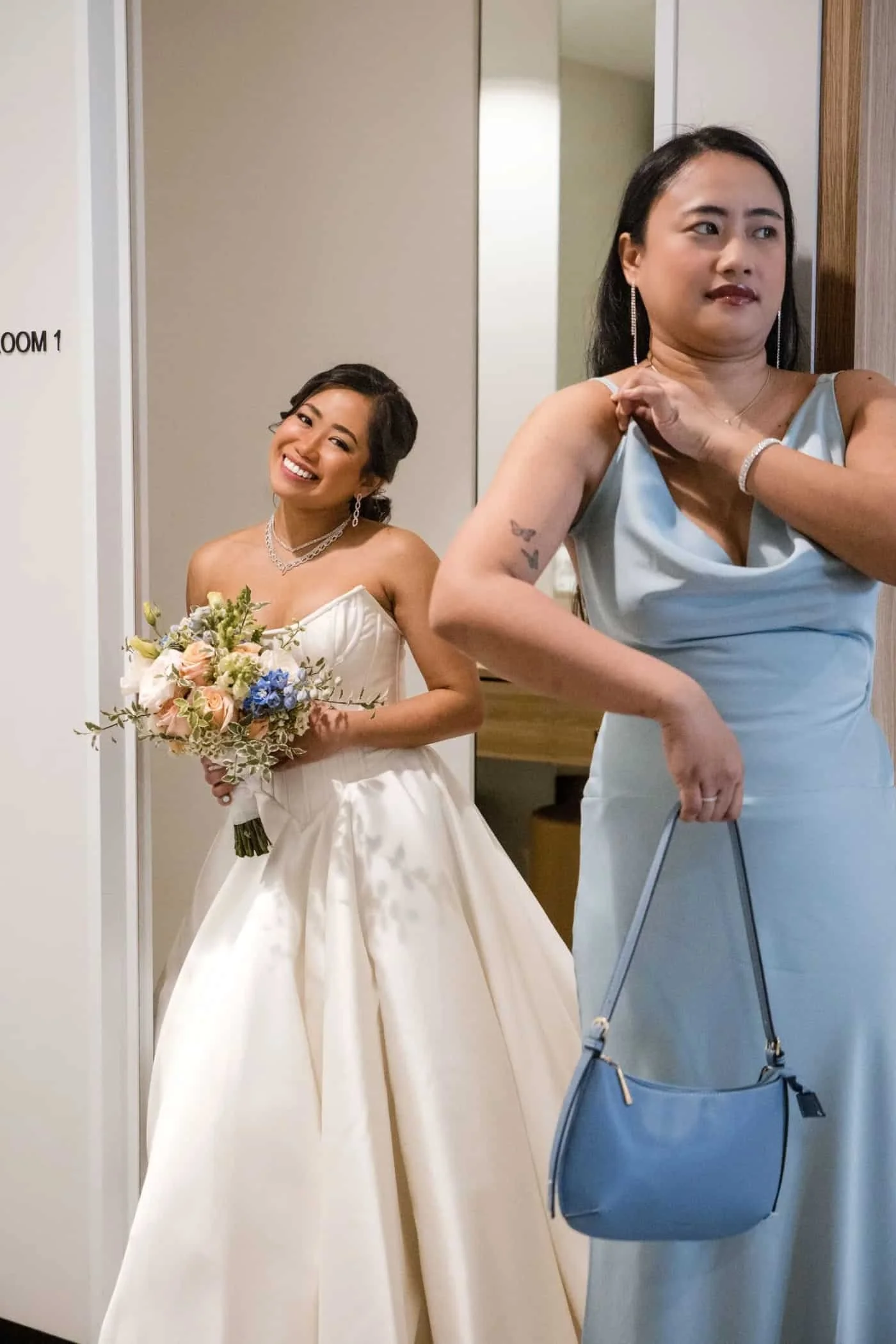 Bride and bridal party celebrating together before the ceremony