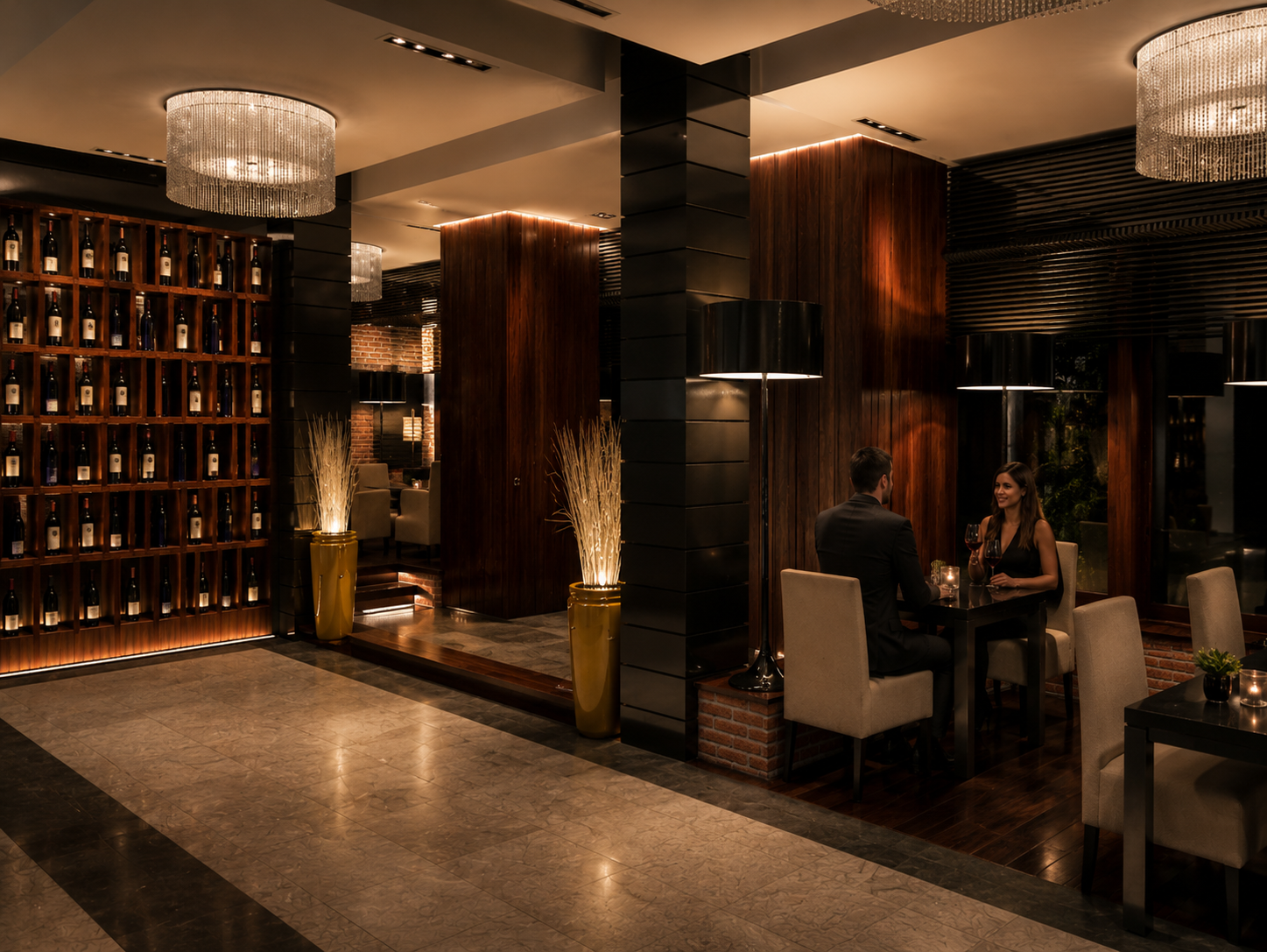 Interior of a sophisticated restaurant or lounge with warm lighting, wooden and brick decor, and a wine display shelf. Two people are seated at a table having a conversation, with wine glasses in hand. Vilanova, Wilanow, Warszawa