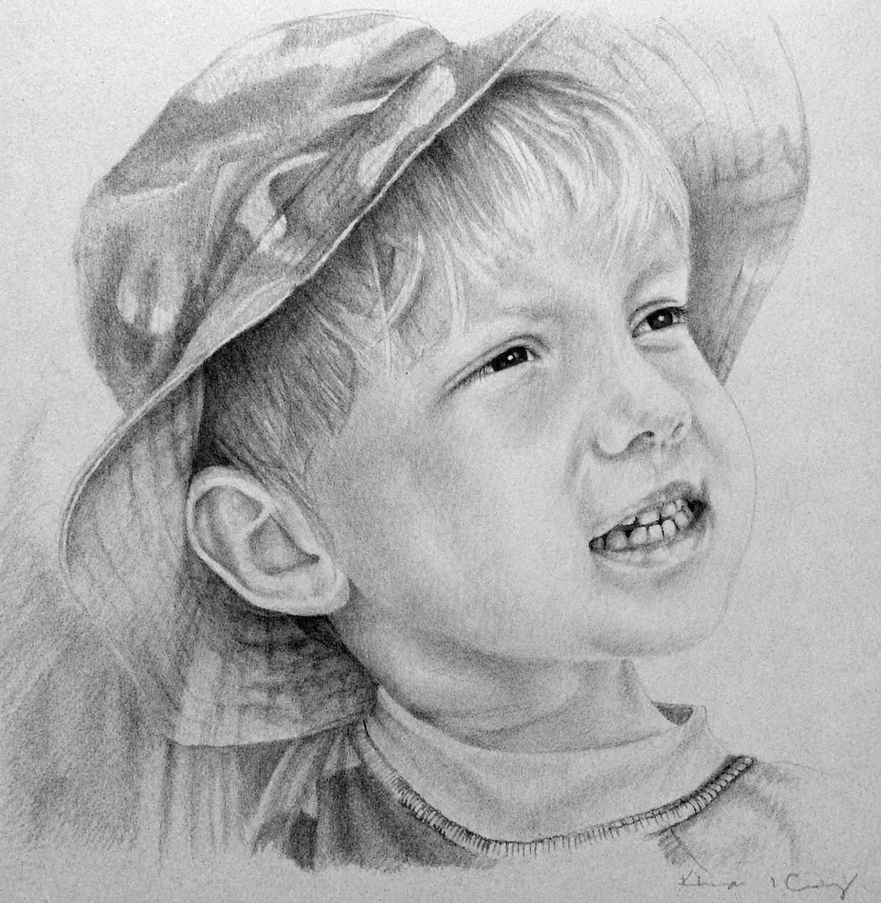 A detailed black-and-white portrait of a young girl with a wide smile, showing her teeth, wearing a large, striped sun hat and a shirt with a visible collar.