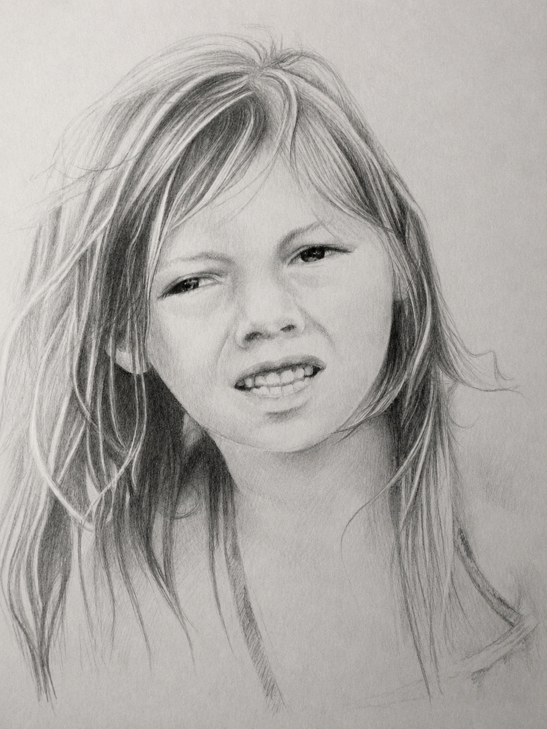 Realistic pencil drawing of a woman with long, wavy hair, smiling slightly with teeth showing, in a black and white style.
