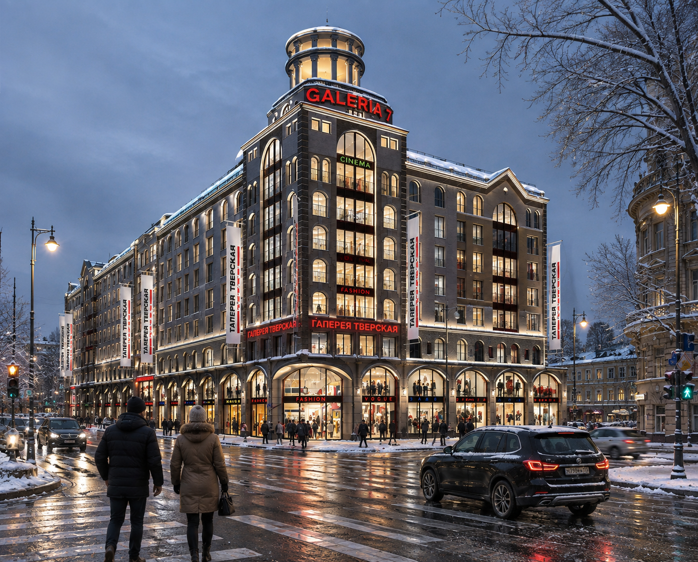 A multi-story shopping mall building with illuminated signage and glass windows at dusk. Snow covers the street and cars, with pedestrians walking across the crosswalk.