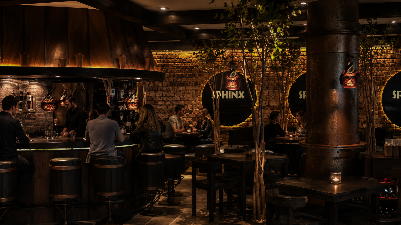 Interior of a dimly lit bar with a brick wall, four tables with chairs, and a curved bar counter where bartenders serve drinks. Several patrons are seated, and small candles illuminate the space, creating a cozy atmosphere. Restaurant, Sphinks