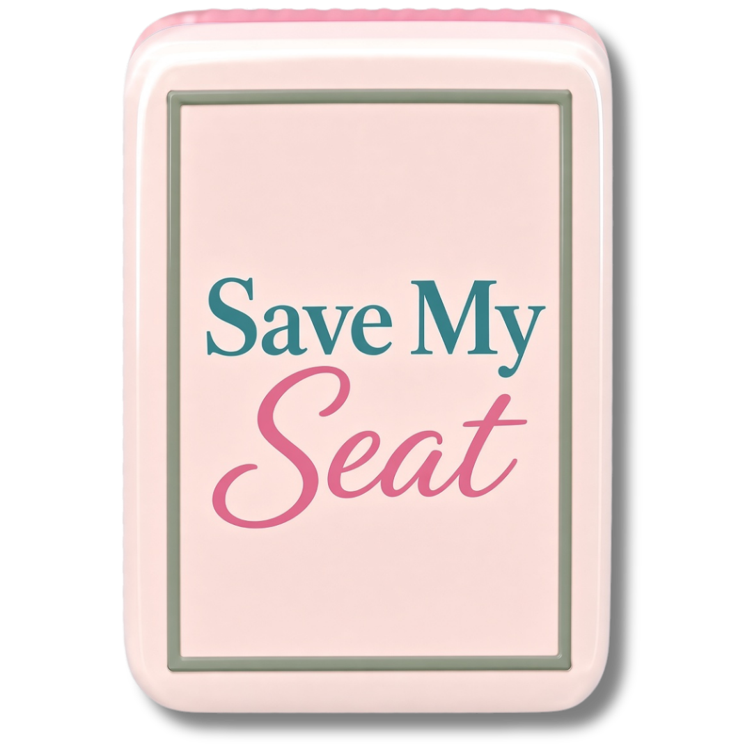A Mahjong Tile with a pink border and background, displaying the text "Save My Seat" in blue and pink fonts.