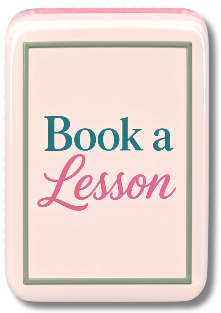 A Mahjong tile with the text 'Book a Lesson' in pink and blue font on a light pink background.
