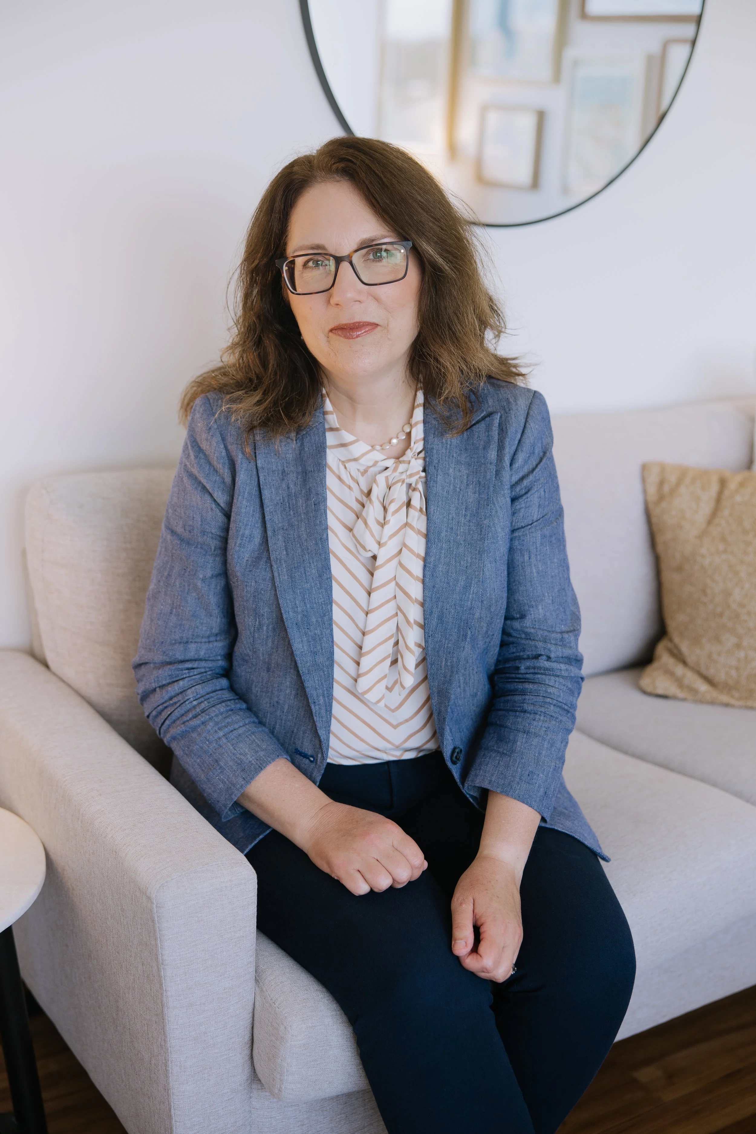 Christina Loftus, founder of HumanEsq™, seated in her office.
