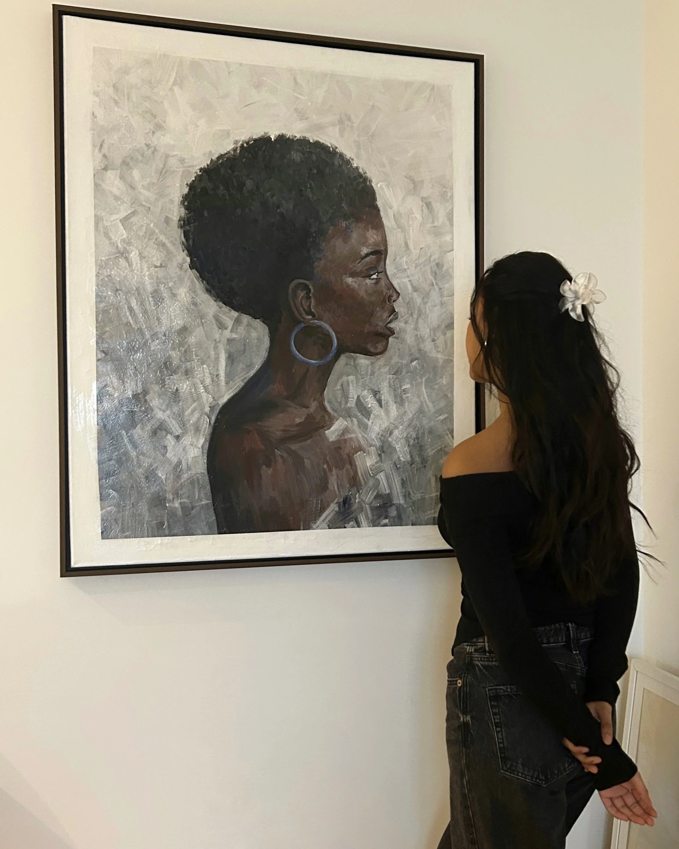 Artist admiring her work