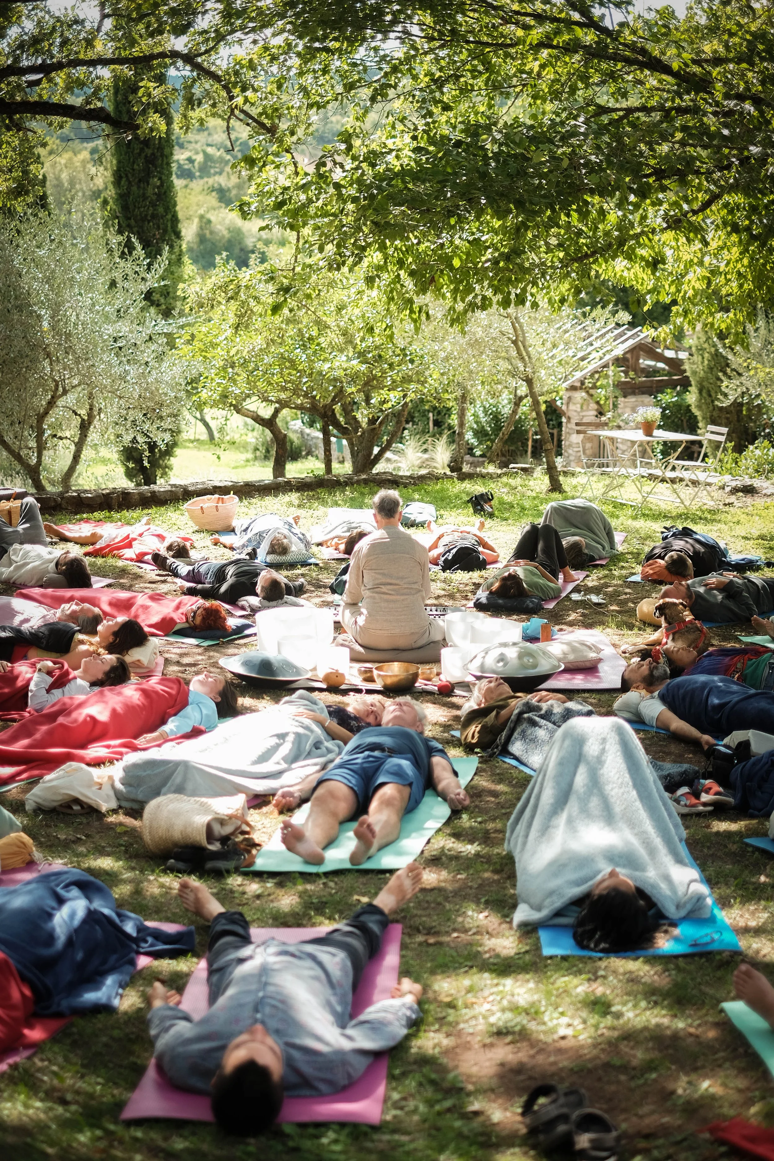 Michael Reiley playing for a sound bath for a large group