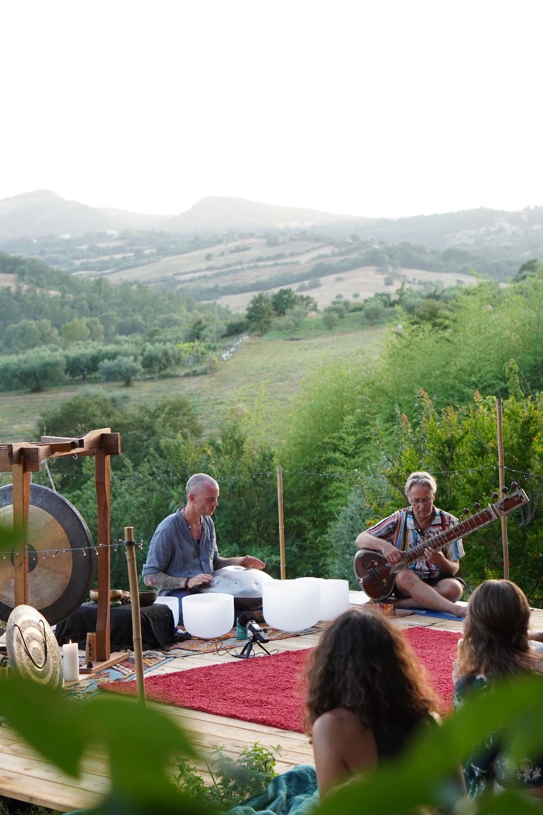 Michael Reiley with a sitar player, playing in Tuscany
