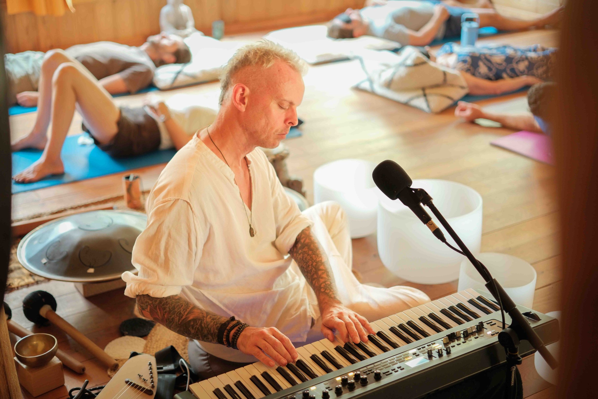 Michael Reiley playing keyboard, crystal bowls