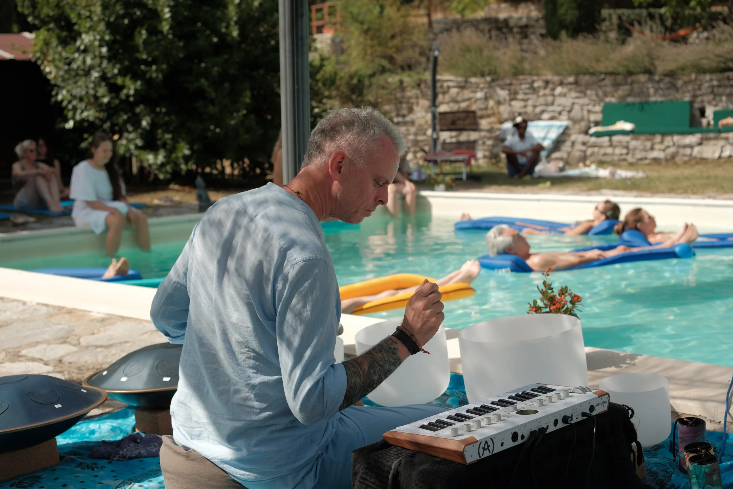 Michael from behind playing crystal bowls