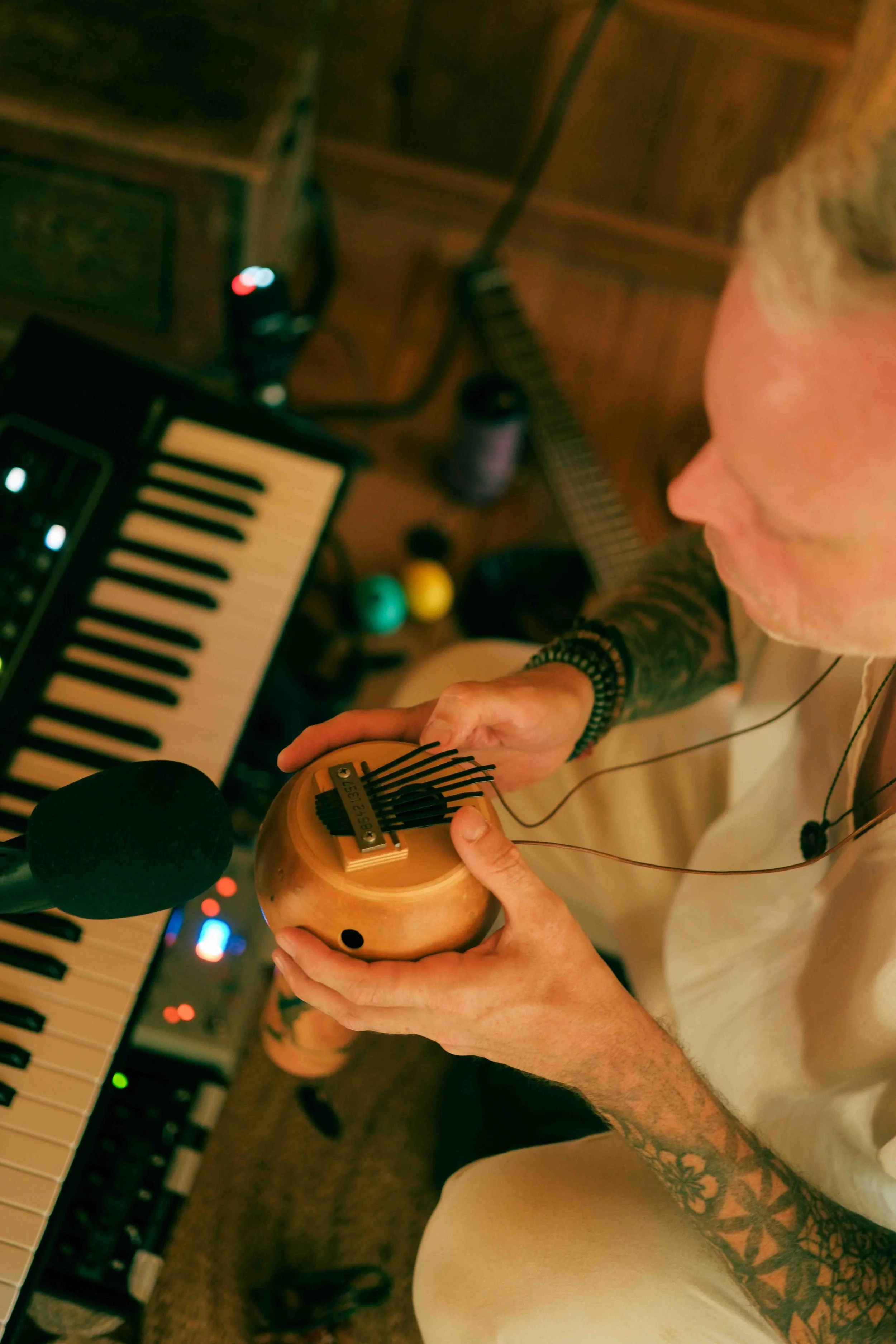 Michael overhead playing thumb piano