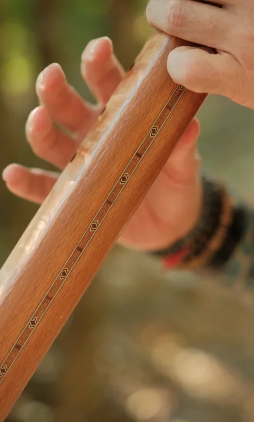 Michael Reiley playing shamanic flute close up