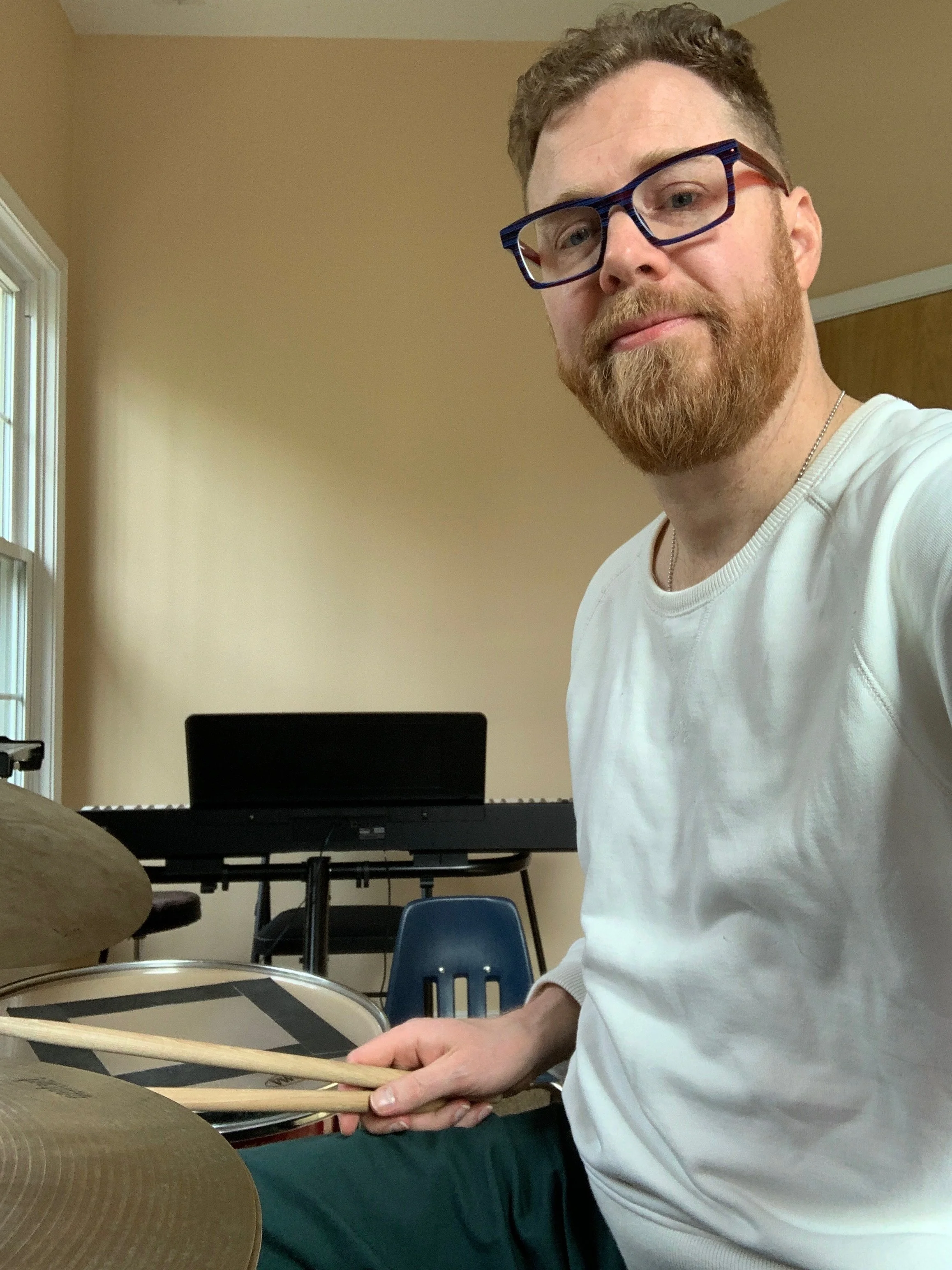 Daniel Hall teaching a drum student in his teaching studio