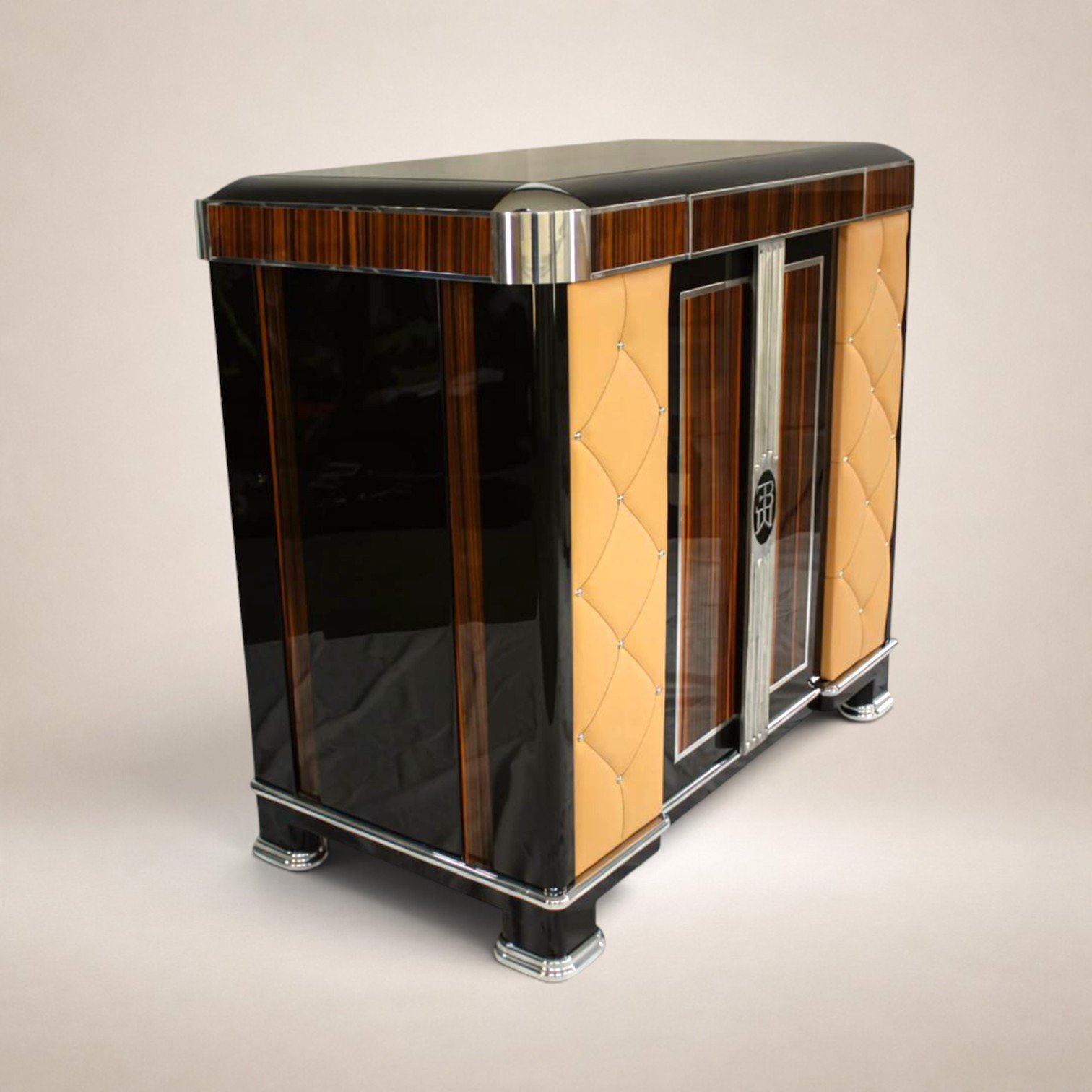 a vintage Art Deco-style bar cabinet with wood and black glossy surfaces, decorative silver accents, and a champagne bottle illustration on the front