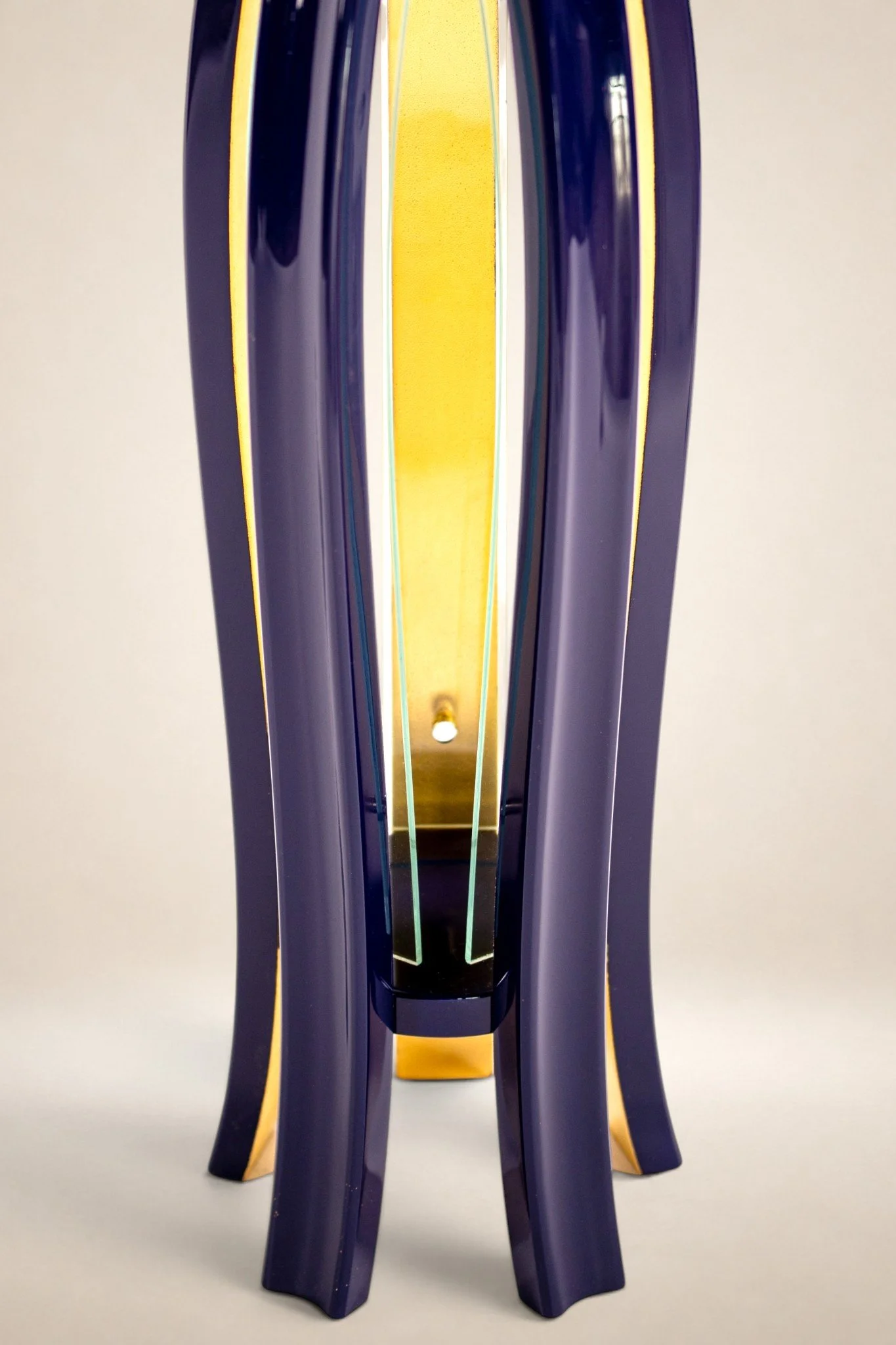 Close-up view of pedestal table. gold leaf 