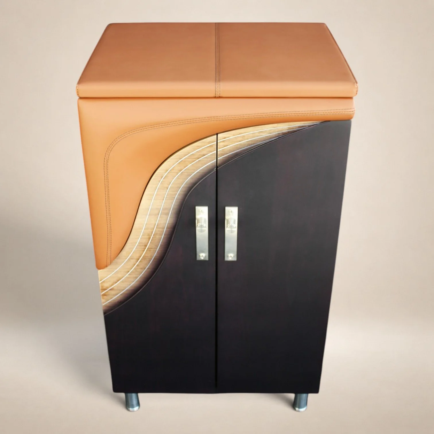 A black cabinet with a curved design on the door, topped with a tan leather seat cushion, metal handles, and standing on four silver legs.