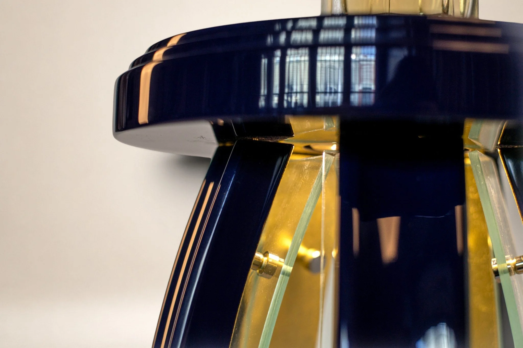 Close up view of top. 24k gold. acrylic glass. hi gloss 