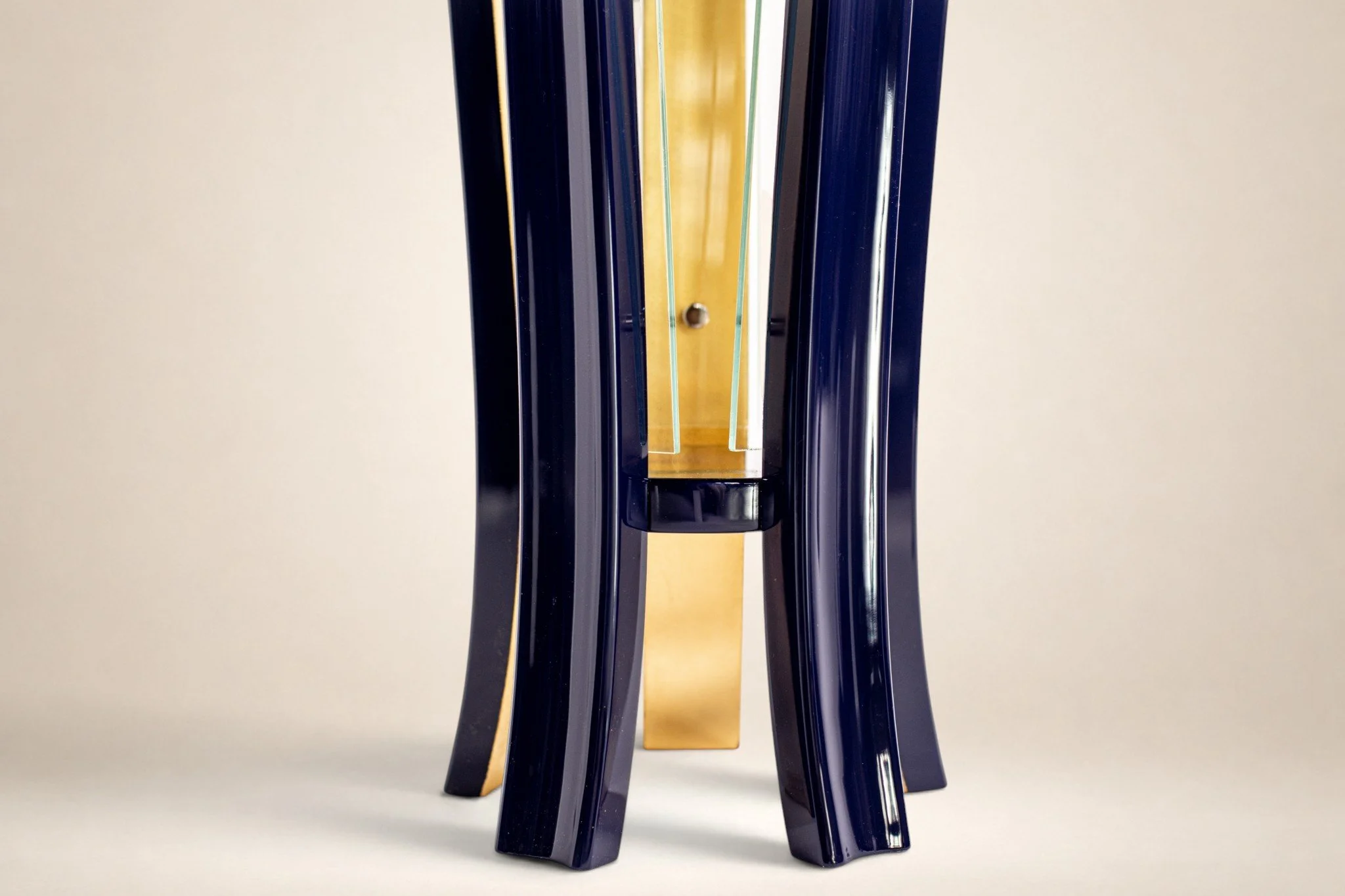 Close-up view of legs of pedestal table 24k gold