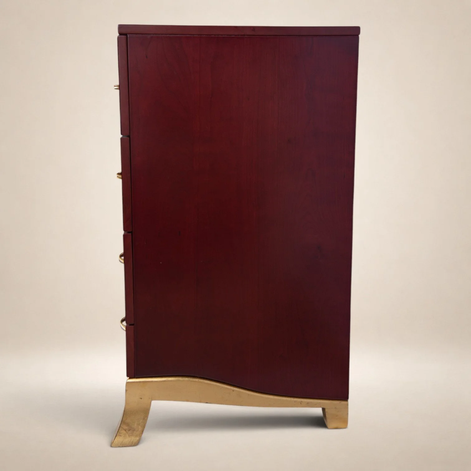 A tall wooden cabinet with a dark reddish finish, standing on light-colored curved legs, against a plain background.