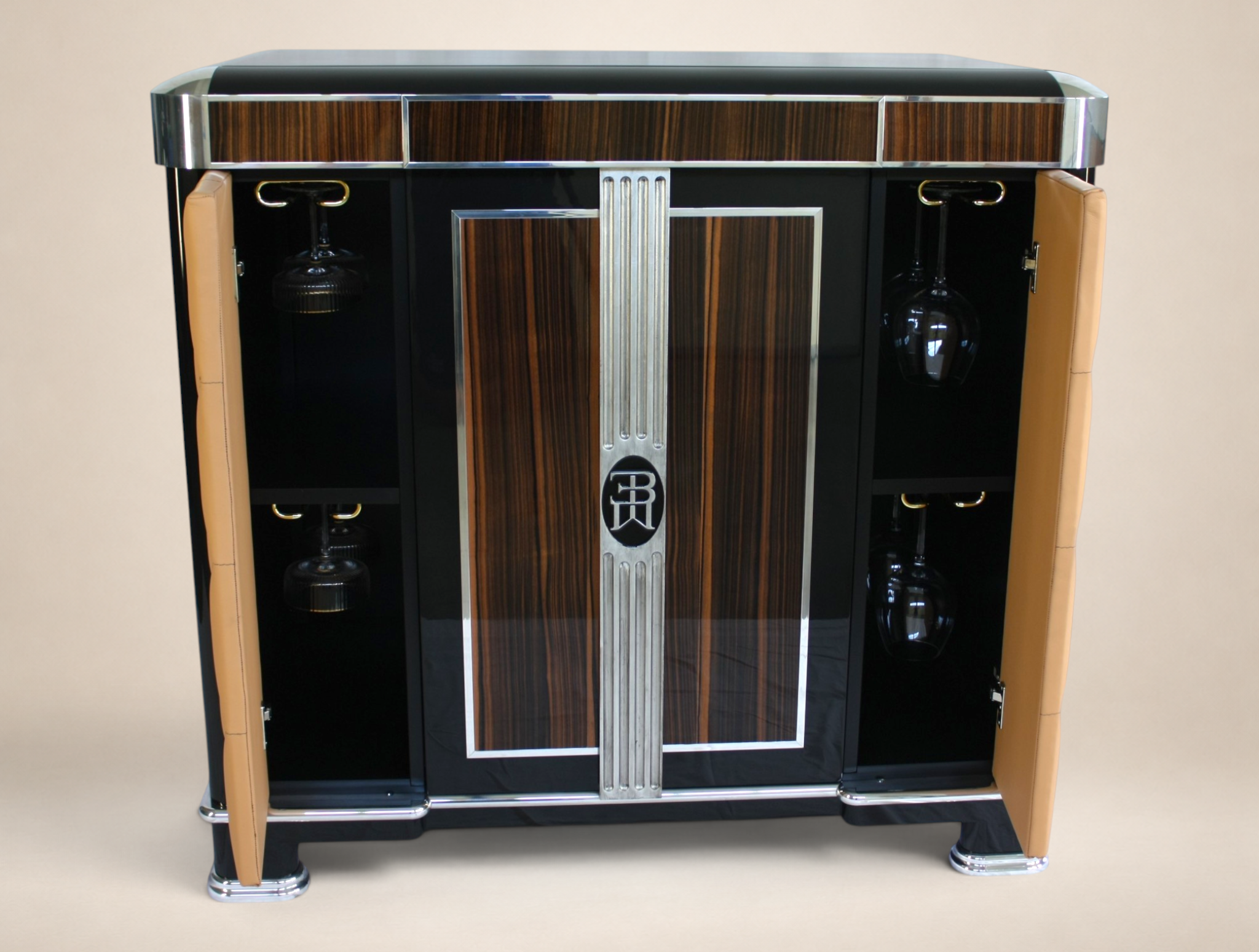 A vintage Barovier & Toso bar cabinet with wood paneling, black accents, and chrome details, flanked by tan upholstered sides.