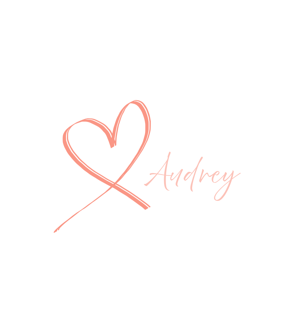 A black background with a pink heart outline and the name 'Audrey' written in pink cursive font.