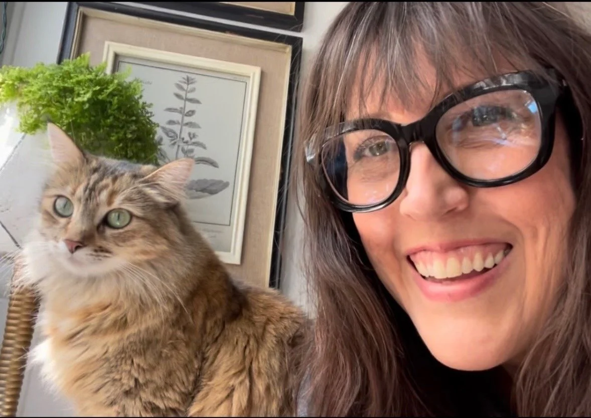Audrey spending time with a cat.