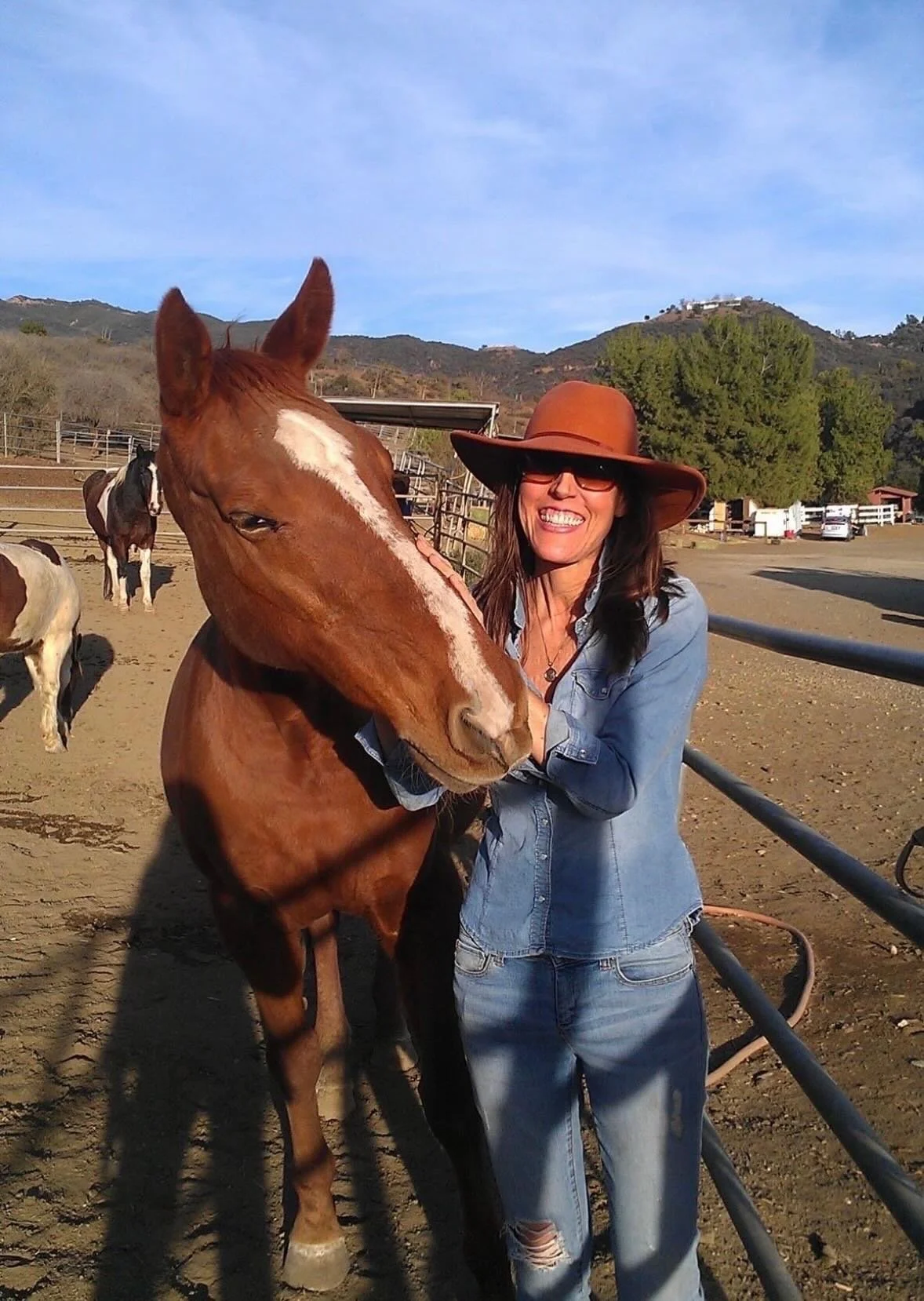 Audrey spending time with a horse.