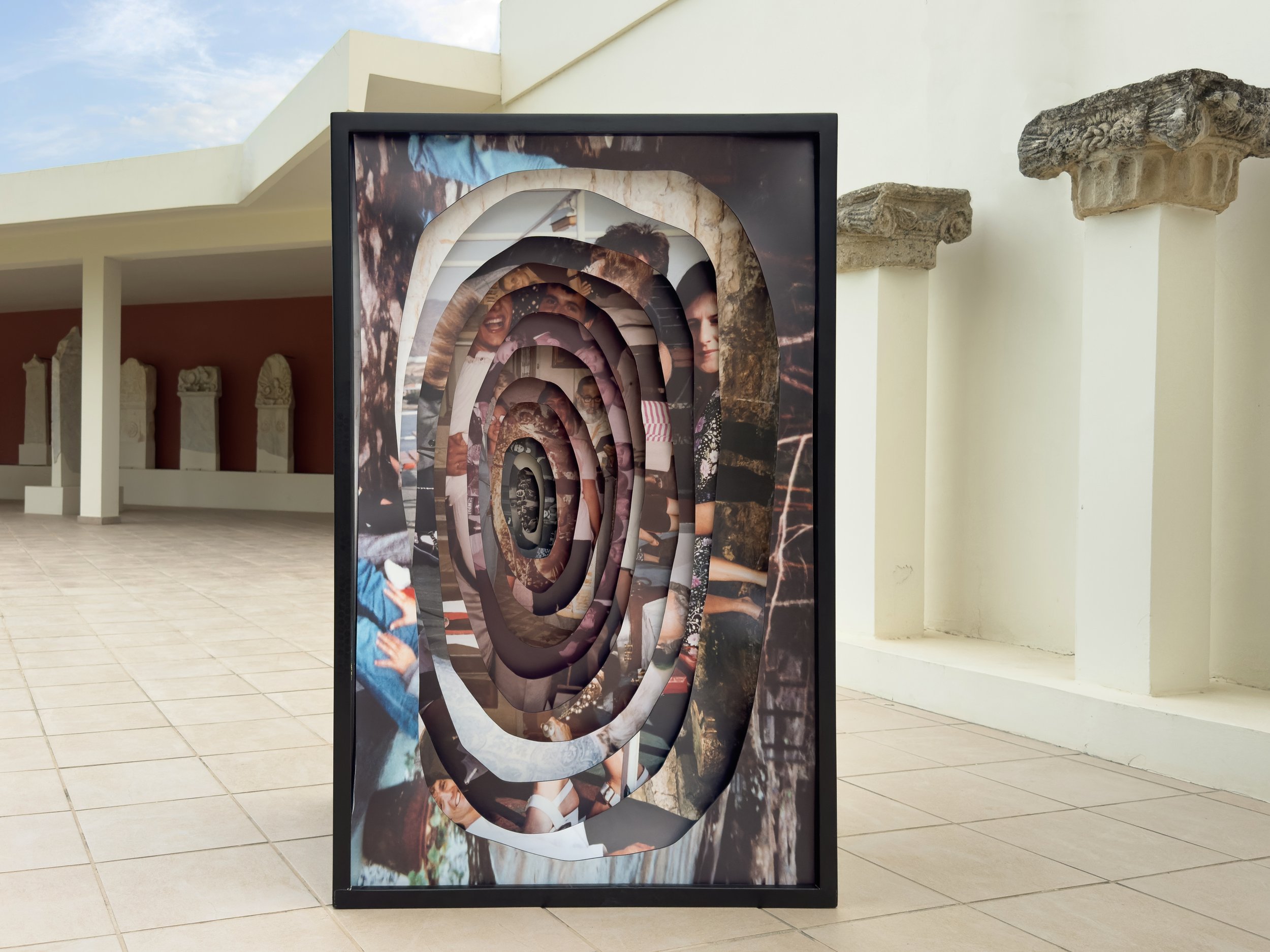 Memory Excavation installation of 13 archival photographs mounted on PVC and enclosed in a custom wooden box, representing entangled memory.