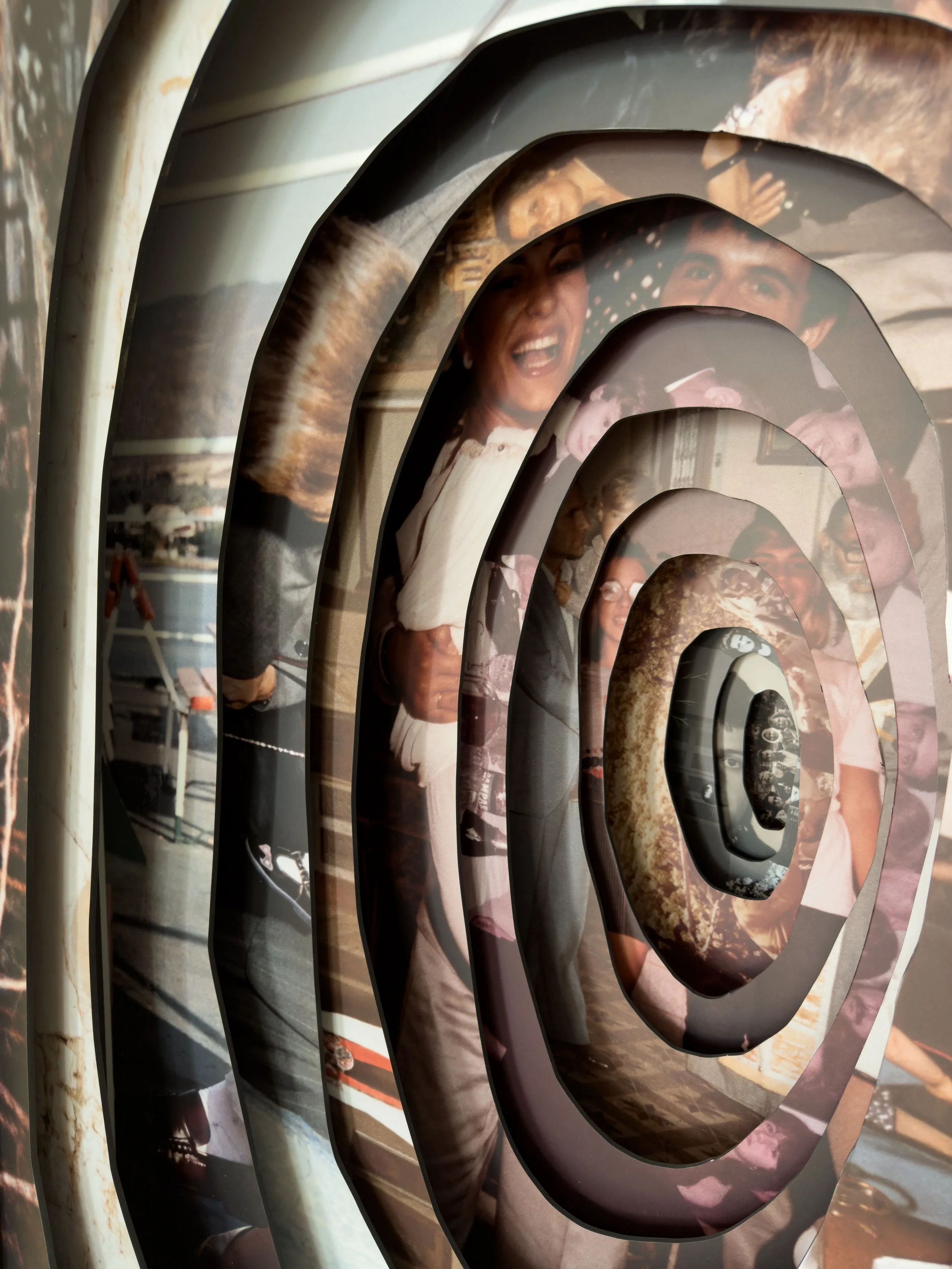 Installation view of Memory Excavation, placing a wooden archive of fragmented family photographs in dialogue with collective memory.