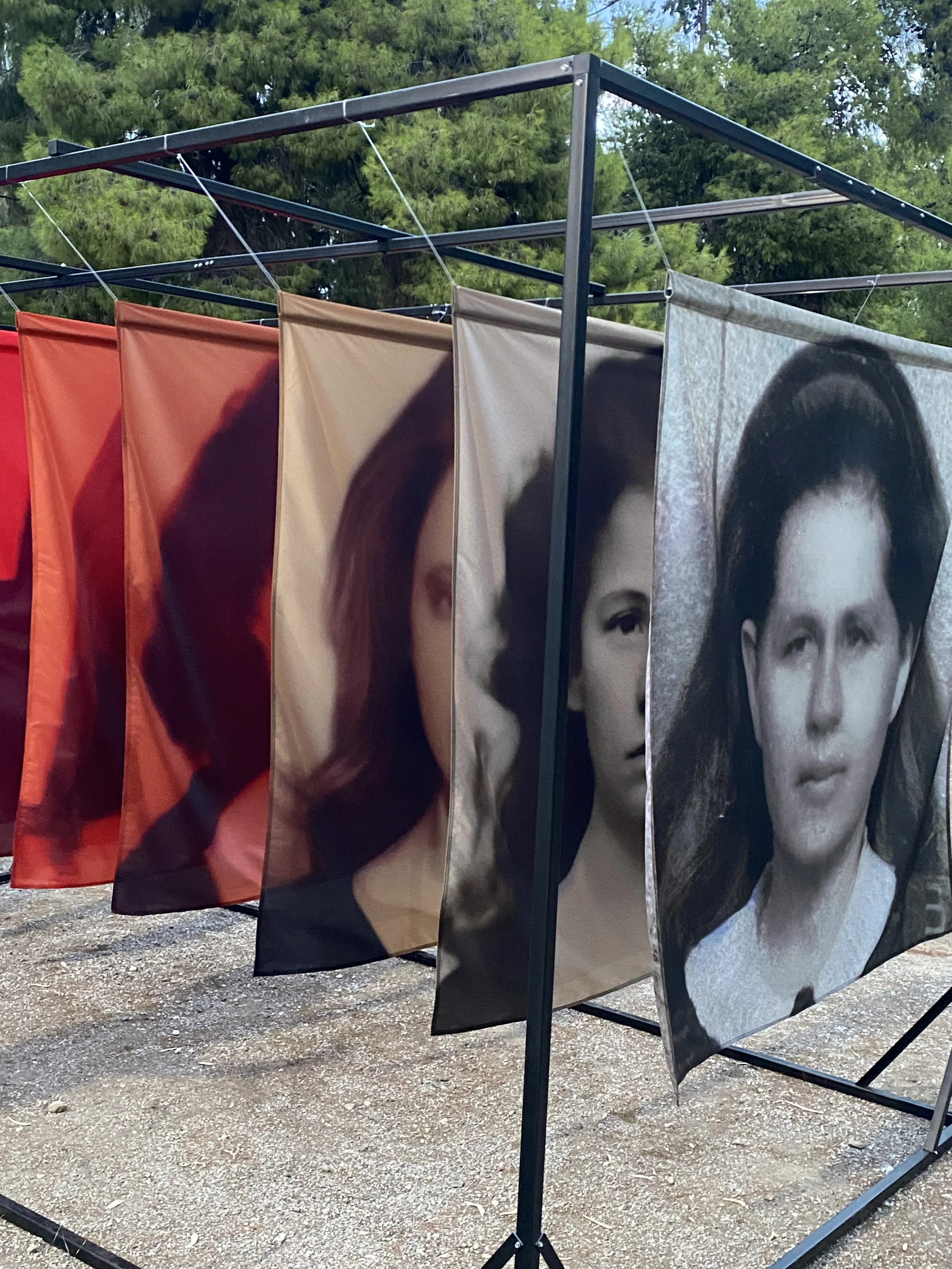 Installation view of Soft Errors, presenting the unknown woman's recursively transformed portrait as translucent layers of fading family memory.
